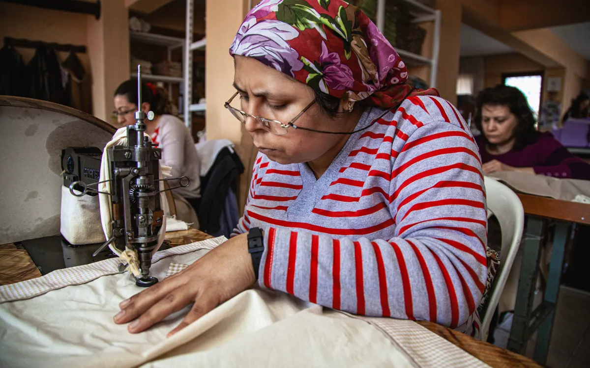 A seamstress at work in a community workshop