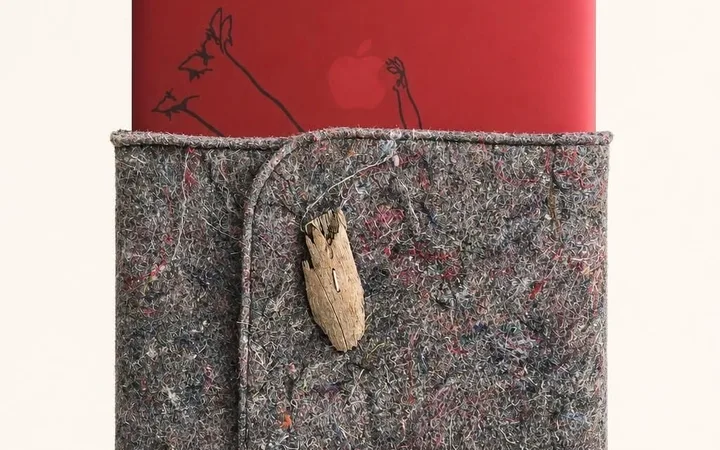 A computer case made from furniture felt and fabric scraps