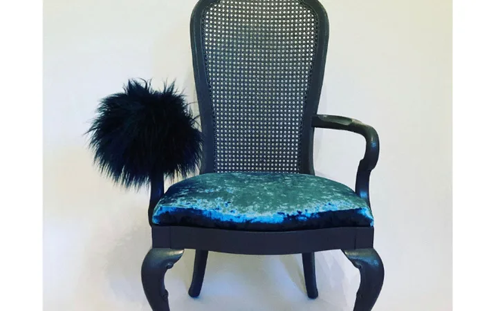 The redesigned armchair, finished, against a white wall