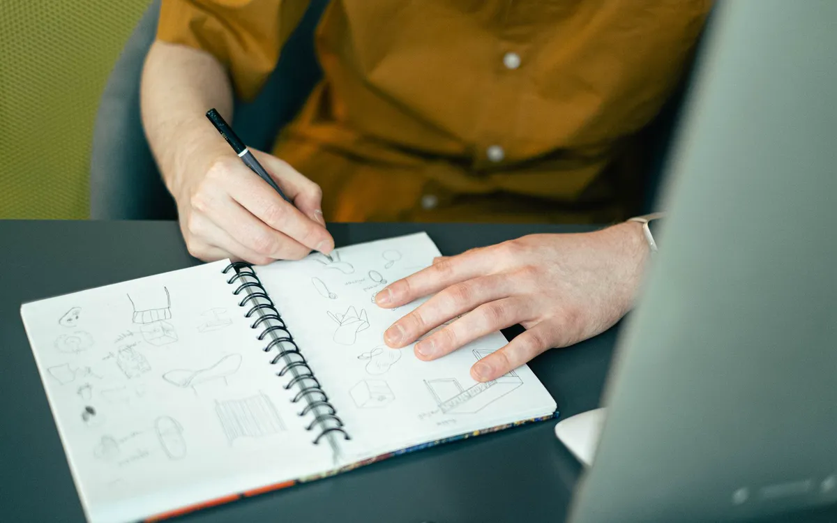 Sketching ideas in a notebook